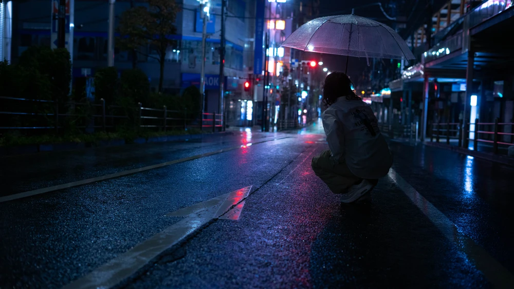 Person in the rainy streets of Shinagawa, Tokyo, Japan